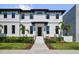 Elegant new construction home showcasing a modern facade, with well-manicured landscaping enhancing its curb appeal at 403 E Davis Blvd, Tampa, FL 33606