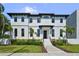 Stunning two-story home with black trim, elegant landscaping, and a welcoming entrance at 403 E Davis Blvd, Tampa, FL 33606