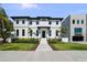 Stunning two-story home with black trim, elegant landscaping, and a welcoming entrance at 403 E Davis Blvd, Tampa, FL 33606