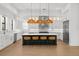 Gourmet kitchen with island, stainless steel appliances, and stylish pendant lighting at 403 E Davis Blvd, Tampa, FL 33606
