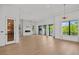 Spacious living room with a fireplace, floor-to-ceiling windows, and access to the outdoor balcony at 403 E Davis Blvd, Tampa, FL 33606