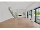 Bright, airy living room with fireplace, hardwood floors, and large windows at 403 E Davis Blvd, Tampa, FL 33606