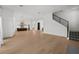 Bright, open living room with hardwood floors and a staircase to the upper level at 403 E Davis Blvd, Tampa, FL 33606