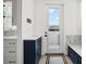Mud room area with built-in bench, storage cabinets, and exterior door at 403 E Davis Blvd, Tampa, FL 33606