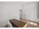 Bright office space with a modern desk, neutral decor, and an ensuite bathroom at 403 E Davis Blvd, Tampa, FL 33606