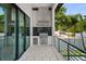 Stylish outdoor kitchen with modern appliances and a sleek design, perfect for al fresco dining and gatherings at 403 E Davis Blvd, Tampa, FL 33606