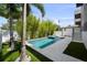 Backyard pool with jacuzzi, decorative landscape, and modern patio, perfect for relaxing and entertaining at 403 E Davis Blvd, Tampa, FL 33606