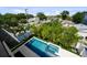 A refreshing private pool and spa complemented by lush landscaping, creating a backyard oasis at 403 E Davis Blvd, Tampa, FL 33606