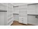 Walk-in closet is equipped with custom cabinetry, shelving, and clothing rods at 403 E Davis Blvd, Tampa, FL 33606
