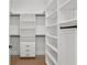 Walk-in closet provides custom storage solutions with adjustable shelves and drawers at 403 E Davis Blvd, Tampa, FL 33606