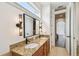 Spacious bathroom with dual sinks, granite countertops, and custom lighting at 407 S Fremont Ave # B, Tampa, FL 33606