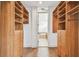 Walk-in closet with custom shelving and storage solutions and easy access to the bathroom at 407 S Fremont Ave # B, Tampa, FL 33606