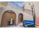 Elegant courtyard with grill, multi-level staircase, and comfortable seating under a screened enclosure at 407 S Fremont Ave # B, Tampa, FL 33606