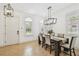 Bright dining area featuring modern chandelier, ample natural light, and neutral accents at 407 S Fremont Ave # B, Tampa, FL 33606