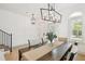 Modern dining room with elegant table setting, stylish lighting, and bright natural light at 407 S Fremont Ave # B, Tampa, FL 33606
