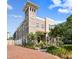 Inviting home exterior boasting a tower, brick driveway, and meticulously landscaped front yard at 407 S Fremont Ave # B, Tampa, FL 33606