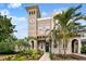 Charming home exterior with a tower feature, inviting front entrance, and lush landscaping at 407 S Fremont Ave # B, Tampa, FL 33606