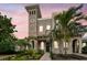 Charming two-story home with a tower and a walkway lined with greenery at 407 S Fremont Ave # B, Tampa, FL 33606