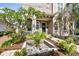 Inviting home featuring a lovely front door with a wreath, surrounded by lush tropical landscaping at 407 S Fremont Ave # B, Tampa, FL 33606