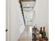 Hallway featuring an open staircase, recessed lighting, and decorative display table at 407 S Fremont Ave # B, Tampa, FL 33606