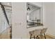 Modern kitchen featuring granite countertops, white cabinets, and stylish bar seating with an open concept design at 407 S Fremont Ave # B, Tampa, FL 33606