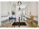 Bright kitchen with granite countertops, stainless steel appliances, and white cabinets at 407 S Fremont Ave # B, Tampa, FL 33606