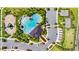 An aerial view of community amenities including a pool, playground, and recreational courts in a well-planned neighborhood at 4917 Eagle Rock Dr, Wimauma, FL 33598