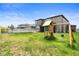 Spacious backyard with grass, a playset, and a white fence at 4917 Eagle Rock Dr, Wimauma, FL 33598