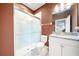 Bathroom featuring a glass-enclosed shower, a toilet, and a vanity with granite countertops and a mirror above at 4917 Eagle Rock Dr, Wimauma, FL 33598