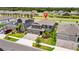 Beautiful two-story home with a three-car garage, paver driveway, manicured lawn, and professional landscaping at 4917 Eagle Rock Dr, Wimauma, FL 33598
