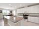 Bright and spacious kitchen with granite countertops, modern appliances, and ample cabinet space at 4917 Eagle Rock Dr, Wimauma, FL 33598