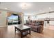 Open-concept living space featuring a seamless flow from the living room to the kitchen at 4917 Eagle Rock Dr, Wimauma, FL 33598