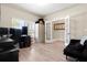 Versatile home office space featuring a large window, neutral walls, and hardwood floors at 4917 Eagle Rock Dr, Wimauma, FL 33598