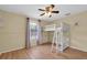 Bright bedroom featuring a bunk bed, ceiling fan and wood-look flooring at 502 Timber Bay E Cir, Oldsmar, FL 34677