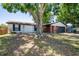 Charming single-story home featuring brick accents, mature trees, and an attached two-car garage at 502 Timber Bay E Cir, Oldsmar, FL 34677