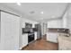 Bright and modern kitchen with stainless steel appliances and white cabinetry and granite countertops at 502 Timber Bay E Cir, Oldsmar, FL 34677