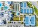 Overhead aerial of community amenities including pools, tennis, clubhouse, bocce ball, and parking at 5090 Caravel Pt, Land O Lakes, FL 34638