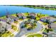 Aerial view of a neighborhood featuring a central roundabout and waterfront homes at 5090 Caravel Pt, Land O Lakes, FL 34638