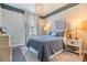 Cozy bedroom showcasing a large bed, stylish decor, and ample natural light from the window at 5090 Caravel Pt, Land O Lakes, FL 34638