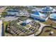 Aerial view of community garden plots, clubhouse, and various community activity venues at 5090 Caravel Pt, Land O Lakes, FL 34638