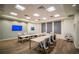 Meeting room with a large conference table, comfortable chairs, and neutral decor at 5090 Caravel Pt, Land O Lakes, FL 34638