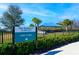 Community dog park featuring a partially covered play area and shade trees at 5090 Caravel Pt, Land O Lakes, FL 34638