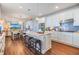 Modern kitchen with a large island, stainless steel appliances, and open floor plan at 5090 Caravel Pt, Land O Lakes, FL 34638