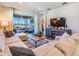 Cozy living room featuring comfortable seating and a view of the screened-in patio at 5090 Caravel Pt, Land O Lakes, FL 34638