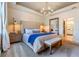 Elegant main bedroom featuring a tufted headboard and neutral tones at 5090 Caravel Pt, Land O Lakes, FL 34638