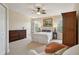 Bright bedroom featuring neutral walls, carpet, ceiling fan, and wardrobe at 542 Harbor Ridge Dr, Palm Harbor, FL 34683