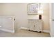 Upstairs hallway with decorative cabinet, artwork, and natural light at 542 Harbor Ridge Dr, Palm Harbor, FL 34683