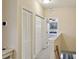Upstairs hallway with closet and doorway to bedroom at 542 Harbor Ridge Dr, Palm Harbor, FL 34683