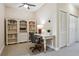 Bright office area with a ceiling fan, shelving, and a desk is ideal for remote work at 542 Harbor Ridge Dr, Palm Harbor, FL 34683