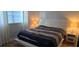Bright bedroom with a window, a modern bed frame, and a clean, contemporary style at 5501 80Th N St # 207, St Petersburg, FL 33709